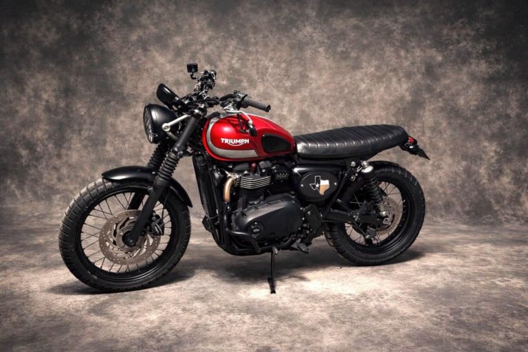 Black custom side panel fitted to a Triumph motorcycle