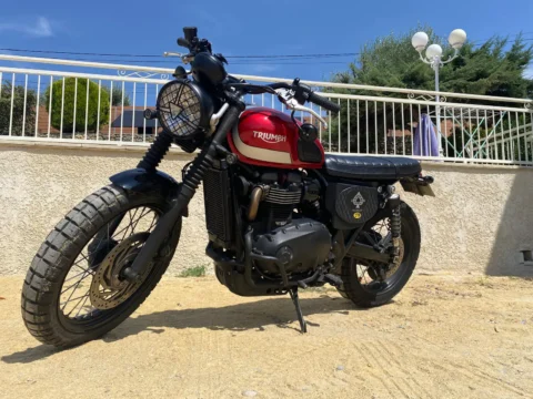 Red Triumph Scrambler 900 three-quarter view